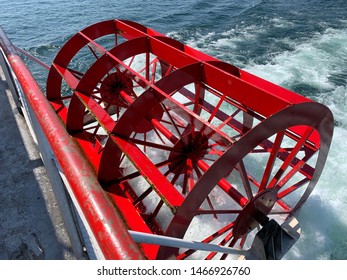 Red Paddle Wheel Of A Boat Up Close