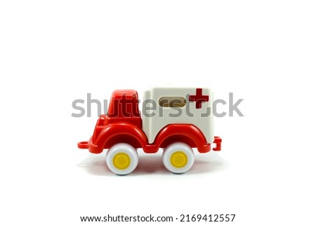 red paint plastic toy ambulance car isolated on white background