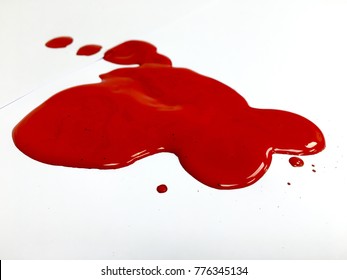 Red Paint Spill On The White Background