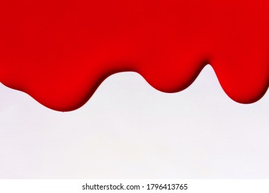 Red Paint Streaks On White Background.Copy Space.