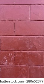 Red Painted Brick Wall Texture Background with Weathered Masonry Pattern and Rustic Construction Surface