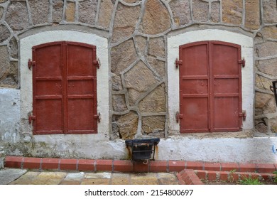 Red Painted Metal Windows On Stone House Background, Isolated Windows, No People, İzmir, Turkey, May 2012.