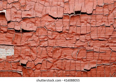 Red Painted old wall. Abstract cracked brown texture. Rustic background