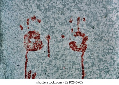 Red Palm Marks On A Metal Sheet Of Iron. Horror, Bloody Palm Prints.