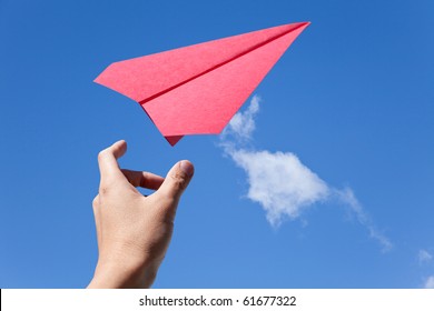 Red Paper Airplane And Blue Sky