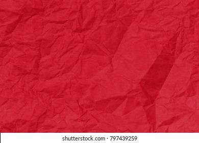 Red paper backround. Red crumpled paper texture. Red crumpled paper texture. Red wrapping paper as Christmas background 