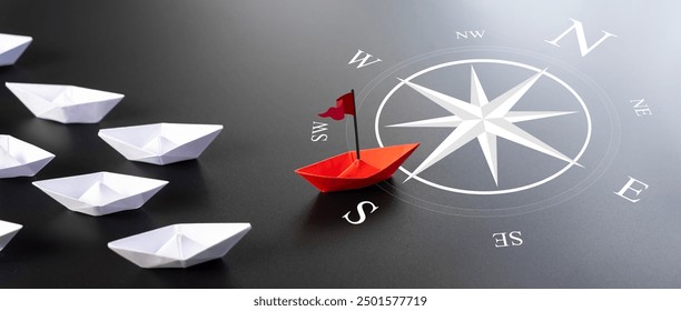 Red Paper Boat On Compass Leading A Fleet Of Small White Boats. Business Leadership Concept. Leaving Mainstream And Changing Direction. Entrepreneur. Business Opportunity