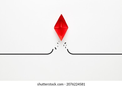 Red paper boat transcends the barrier. To overcome difficulties, problems or boundaries in business concept