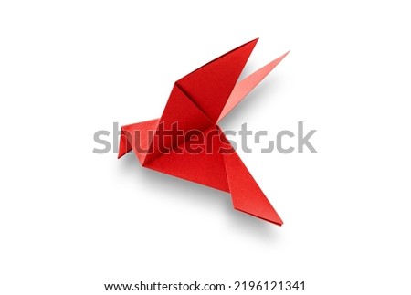 Red paper dove origami isolated on a blank white background.