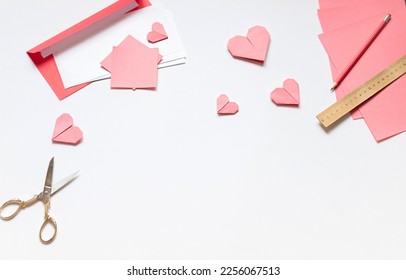 Red paper envelope with white blanks and pink origami hearts. Valentine's day concept card. Copy space - Powered by Shutterstock