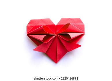 Red paper heart origami isolated on a blank white background. Valentines day card
