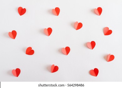 Red Paper Hearts On White Background. Top View. Valentine's Day. Symbol Of Love. Copy Space.