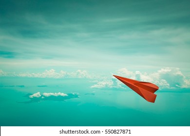 Red paper plane flying on clear sky  background,Copy space, Business concept. - Powered by Shutterstock