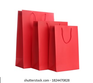 Red paper shopping bags isolated on white