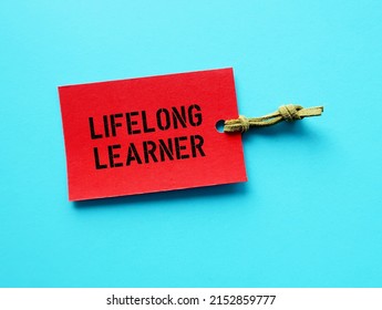 Red Paper Tag On Blue Background With Text LIFELONG LEARNER, People Who Focus On Continual Learning New, In-demand Skills For Personal Development, Keeps Acquiring New Skills Past Formal Education 