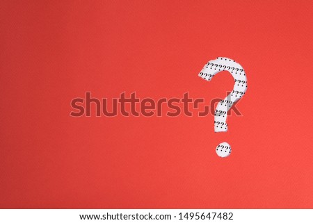 red paper teared to question mark symbol revealing more question mark on white paper. concept of FAQ, Q&A, search, riddle and information