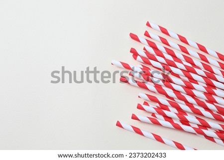 Red paper tubes on a colored background