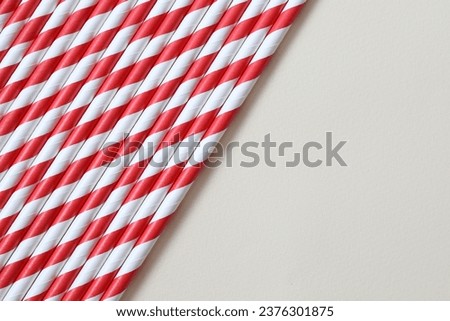 Red paper tubes on a colored background