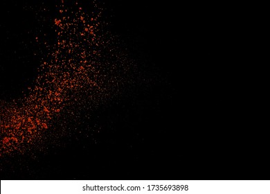 Red Paprika Spices Powder Explosion, Flying Chili Pepper Isolated On Black Background. Splash Of Spice Background. 