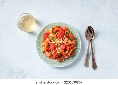 Red Pasta With Wine. Penne With Chicken, Tomato Sauce, Tomatoes, And Parsley, Overhead Flat Lay Shot With A Glass Of Wine