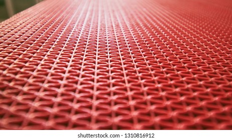 the red patterned texture showing the beautiful plastic curved lines creating an awesome red background