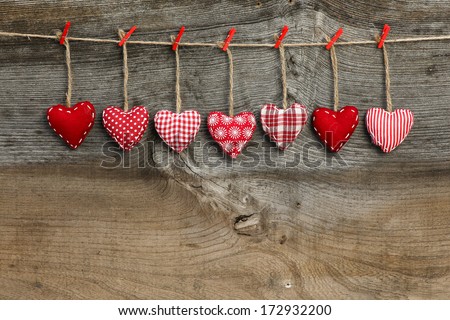Red patterned  Valentine's hearts hanging on rustic Elm wooden texture background, copy space Stock fotó © 