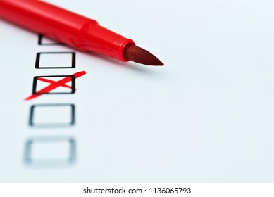 Red Pen Marks Checkbox With A Cross.