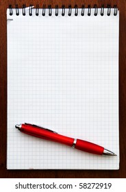 Red Pen And Spiral Notebook