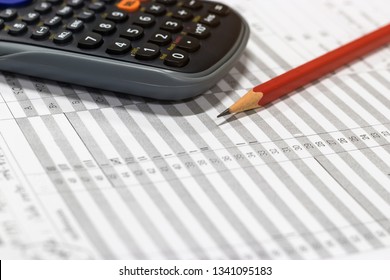 Red pencil and calculator on paper of final grade for each course at the end of semester. The number of grade points a student earned in a given period of time of school. Grading in education concept.