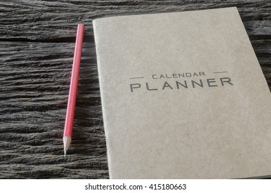 Red Pencil And Planner Book