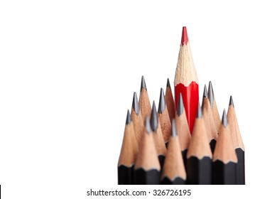 Red pencil standing out from crowd of plenty identical black fellows on white background. Leadership, uniqueness, independence, initiative, strategy, dissent, think different, business success concept