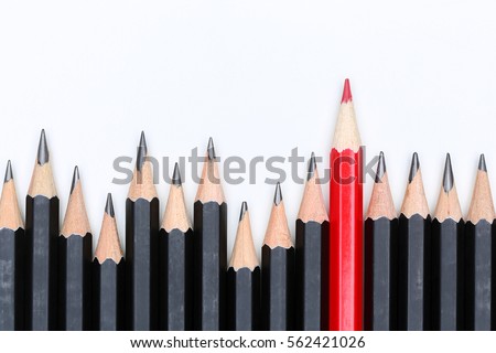 Red pencil standing out from crowd of plenty identical black fellows on white background. Leadership, uniqueness, independence, initiative, strategy, dissent, think different, business success concept