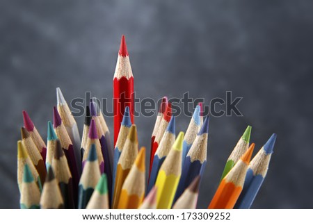 Red pencil standing out from others