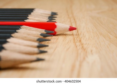 Red Pencil Standout From Black Pencil, Leadership Business Concept