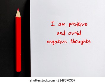 Red Pencil Write On Paper Note I AM POSITIVE AND AVOID NEGATIVE THOUGHTS, Concept Of Affirmation Message Or Self Talk To Challenge Negative Inner Voice And Boost Self Esteem