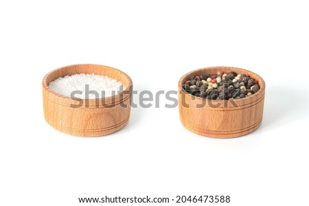 Red pepper and black papper and salt on wooden bowl on white background. Isolated papper
