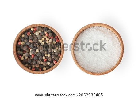 Red pepper and black papper and salt on wooden bowl on white background. Isolated papper