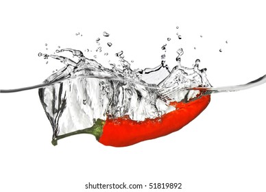 red pepper dropped into water with splash isolated on white