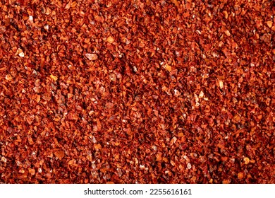 Red pepper flakes. Heap of crushed peppers. Top view of dried chili peppers. Close up - Powered by Shutterstock