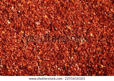 Red pepper flakes. Heap of crushed peppers. Top view of dried chili peppers. Close up