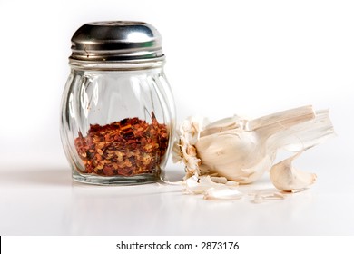 Red Pepper Flakes In Shaker & Garlic Cloves