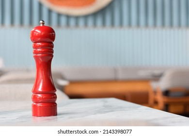 Red Pepper Grinder Placed On The Table 