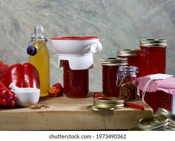 Red Pepper Jelly Canning Preserving Equipment And The Filled Jars