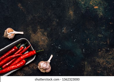 Red Pepper On Black Background.Spicy.Food Concept.Top View.Vegetable Menu.To Describe Spicy Dishes.Hot Offer.Сhili Flat Lay.Mexican Food.Packing Chili Peppers