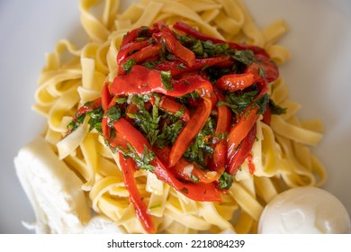 Red Pepper Pasta With Cheese And Eggs Served On The Plate