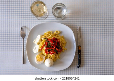 Red Pepper Pasta With Cheese And Eggs Served On The Plate