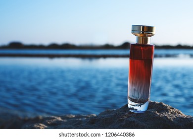 Red Perfume On Blue Sky Background Stock Photo 1206440386 | Shutterstock