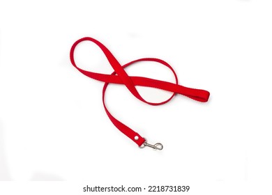 Red pet hook leash on a white background with copy space