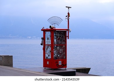 Red Phone Booth Art Installation In Memory Of Founder Of Montreux Jazz Festival At City Of Montreux On A Cloudy Spring Day. Photo Taken April 4th, 2022, Montreux, Switzerland.