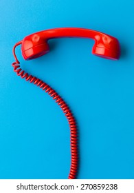 Red Phone Receiver On Blue Background